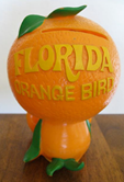 The back of an Orange Bird coin bank