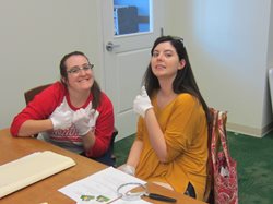 Two students reviewing archival documents