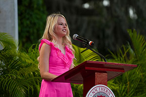 Saylor Kirkpatrick speaking at podium.