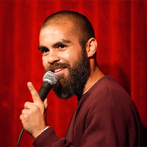 Rojo Perez '07 performing at a comedy show.